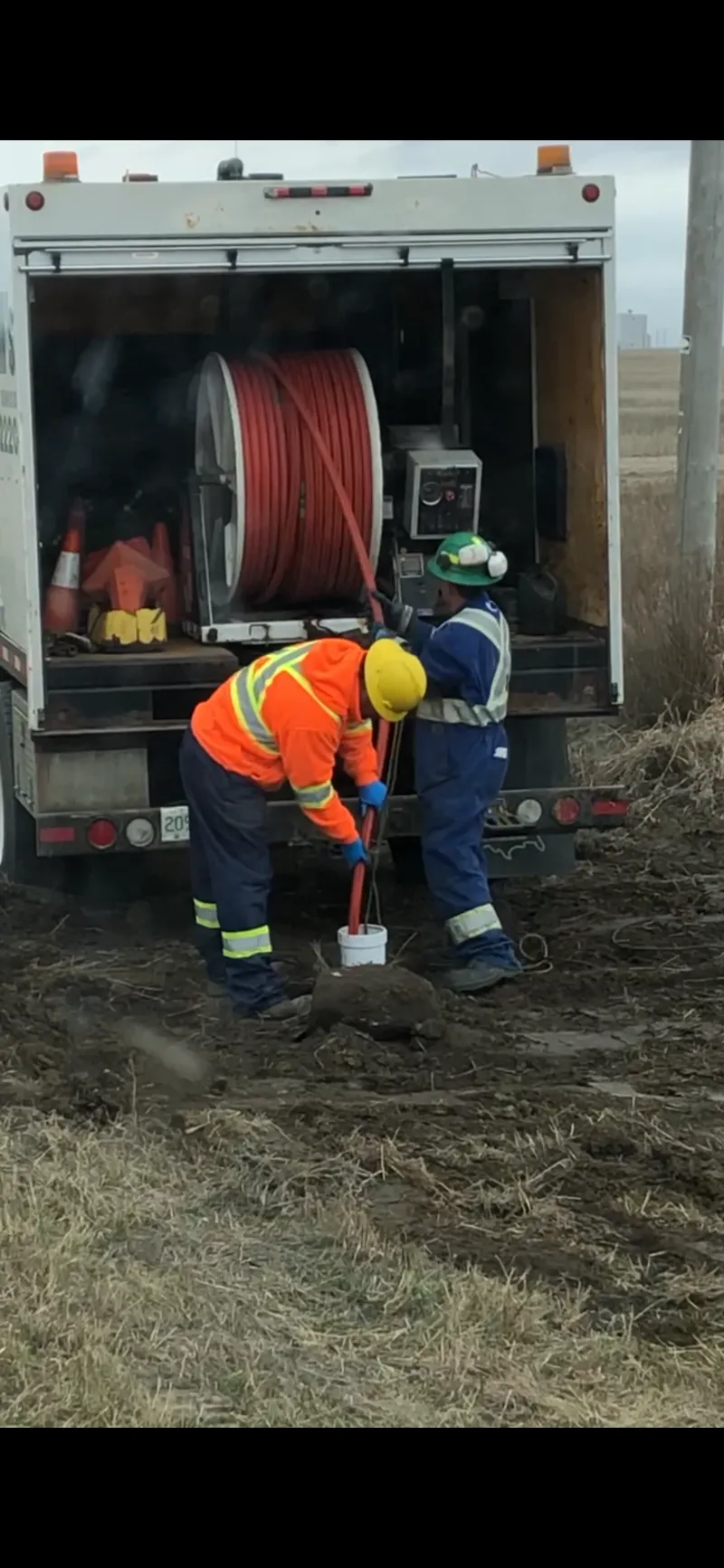 Saw cut around a manhole frame prior to adjustment